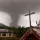 Mount Soputan spews volcanic ash toward Kota Menara village in South Minahasa on Oct. 3.